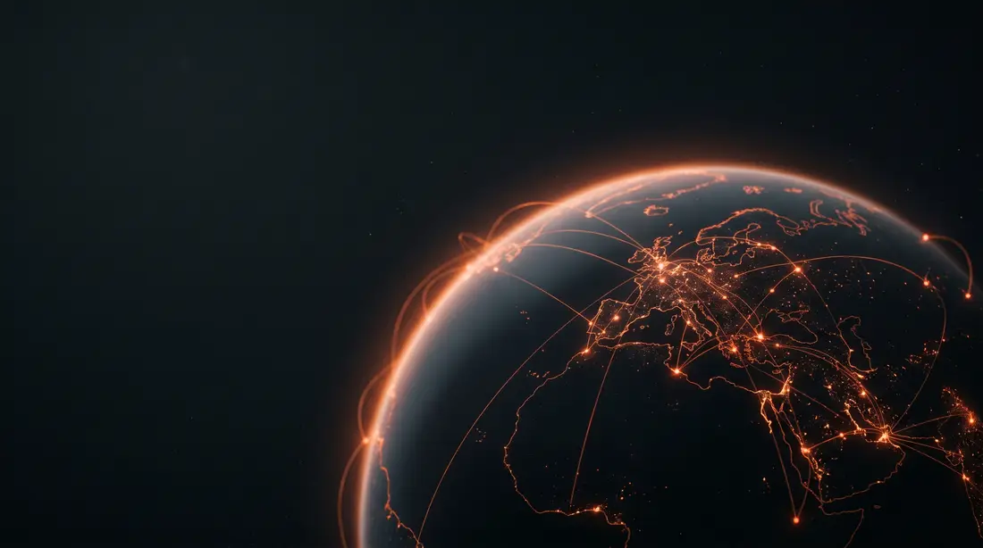 A dark globe wrapped in glowing orange network arcs connecting continents